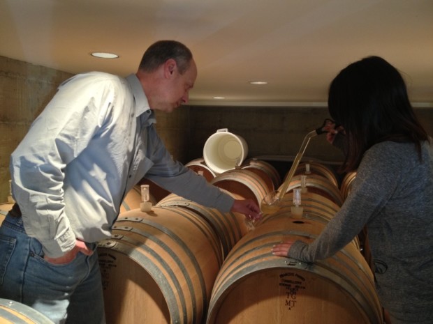 Jr learning how to climb barrels and use a wine thief w Jim Varner