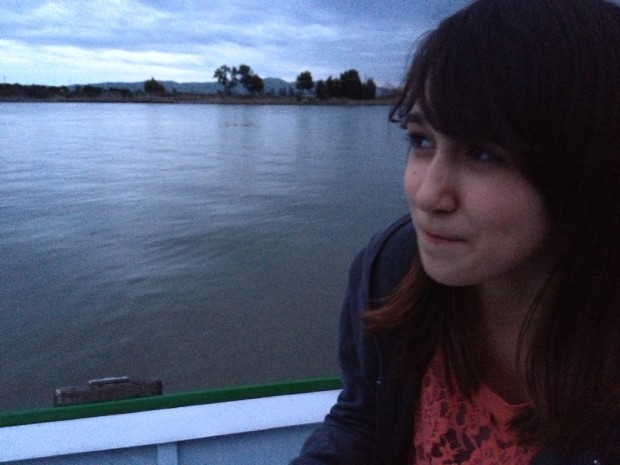 Sitting at dusk in a little boat