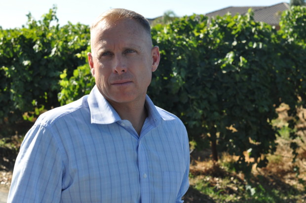 Russ Fields in front of his Syrah Vineyard